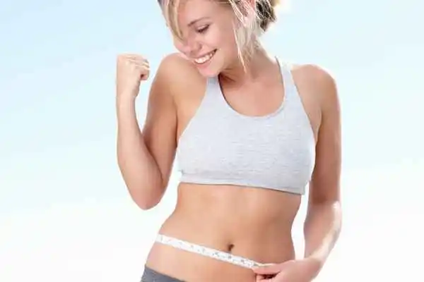 woman happy after fat reduction treatment Higham Ferrers
