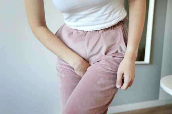 woman struggling with urine incontinence Higham Ferrers