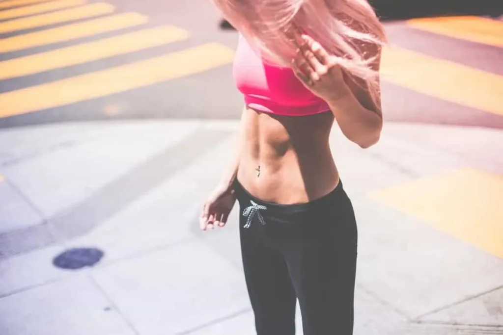 Woman with toned stomach after LA-EMS Body Sculpting Treatment Higham Ferrers
